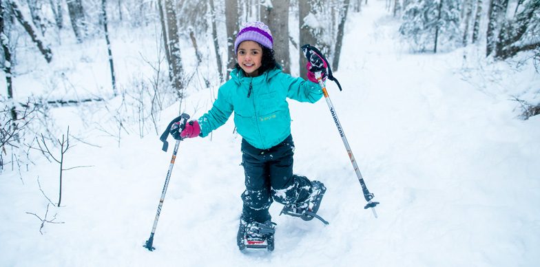 Girl Snowshoeing in the Woods